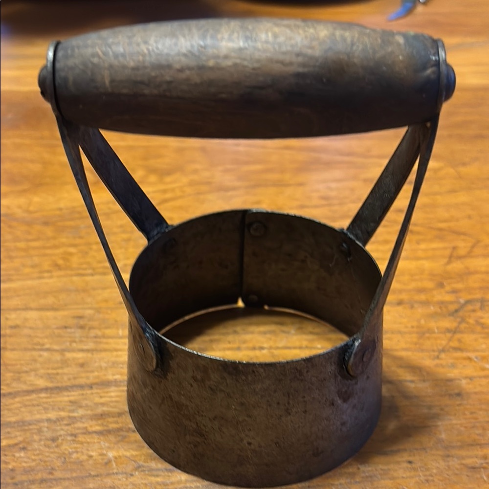 Vintage metal with wooden handle 3 1/2” round riveted rustic biscuit cutter
